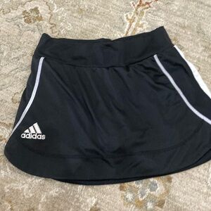 Adidas athletic skirt with shorts built in.